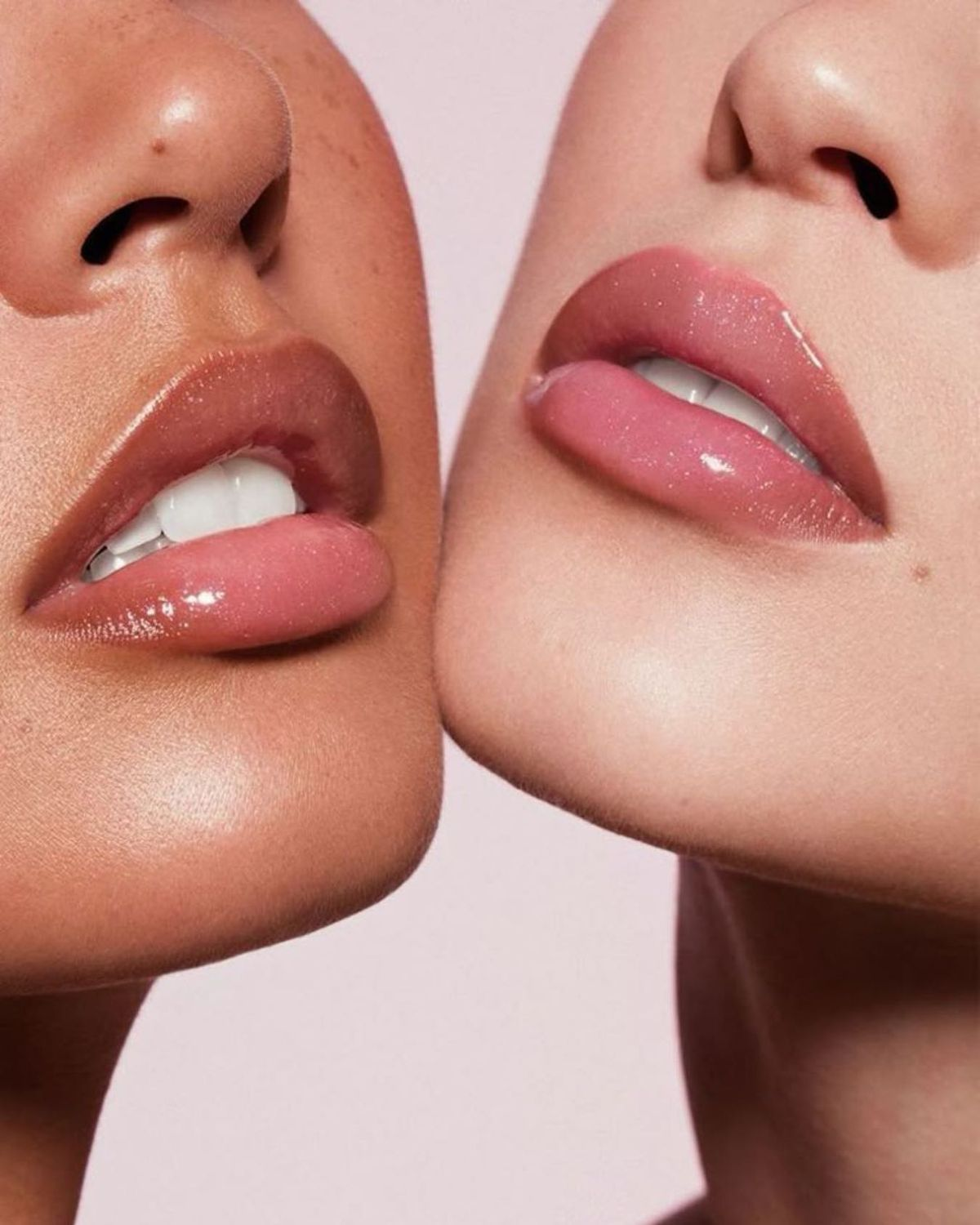 Close-up of two clients' glossy lips showing soft lip blush color